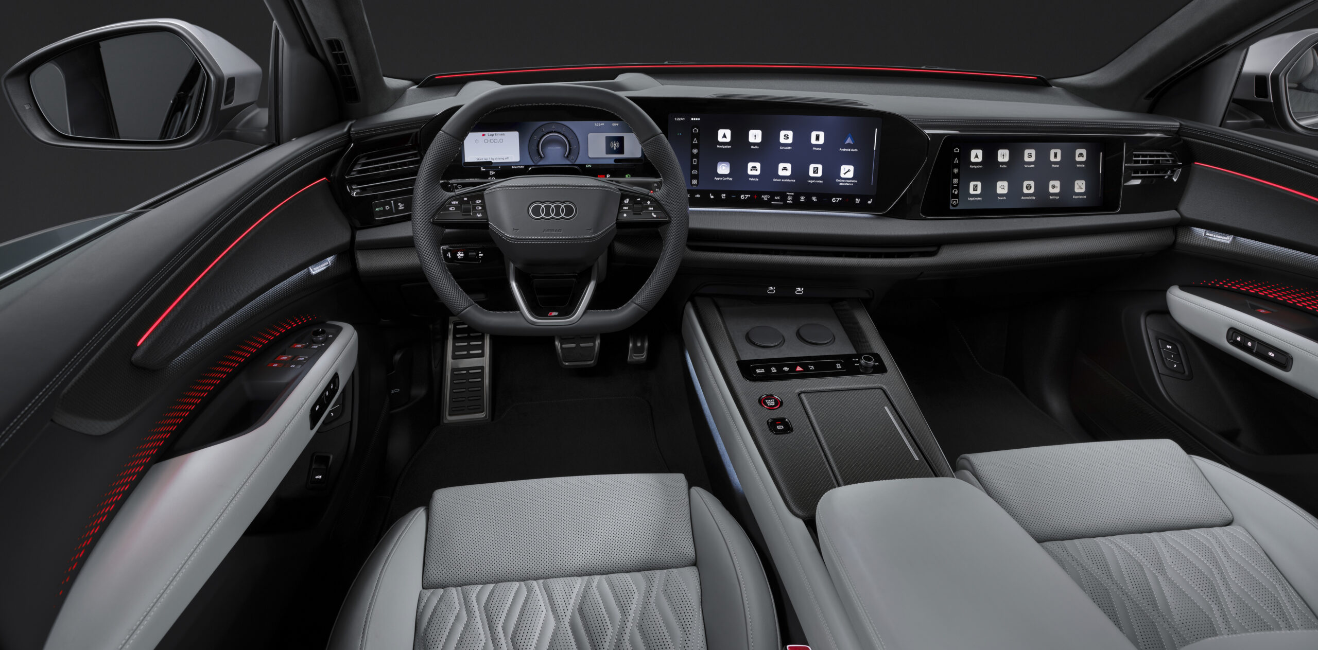 Interior do Audi Q9 com painel digital panorâmico e ambiente tecnológico premium
