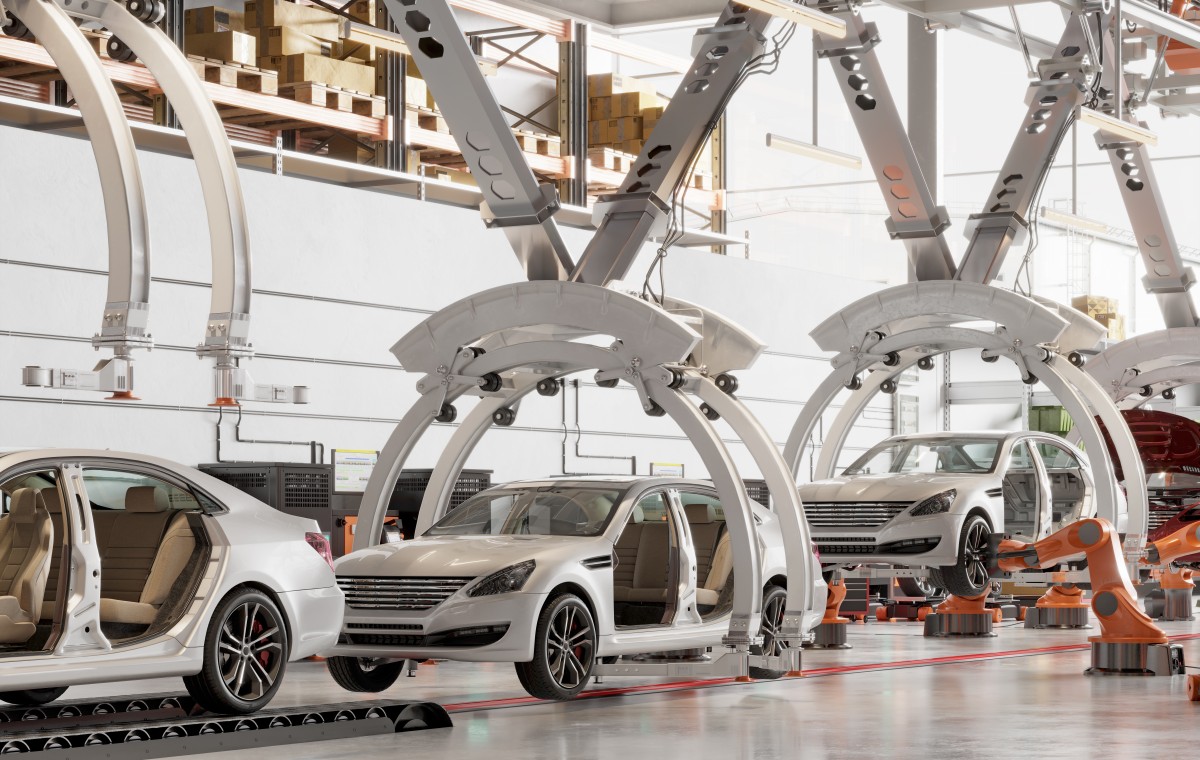 Linha de montagem de veículos eléctricos com robots industriais, simbolizando a modernização da produção automóvel na Europa